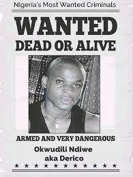 Wanted poster titled 'Nigeria's Most Wanted Criminals' featuring Okwudili Ndiwe, also known as Derico. The poster warns 'WANTED DEAD OR ALIVE' and describes him as 'ARMED AND VERY DANGEROUS